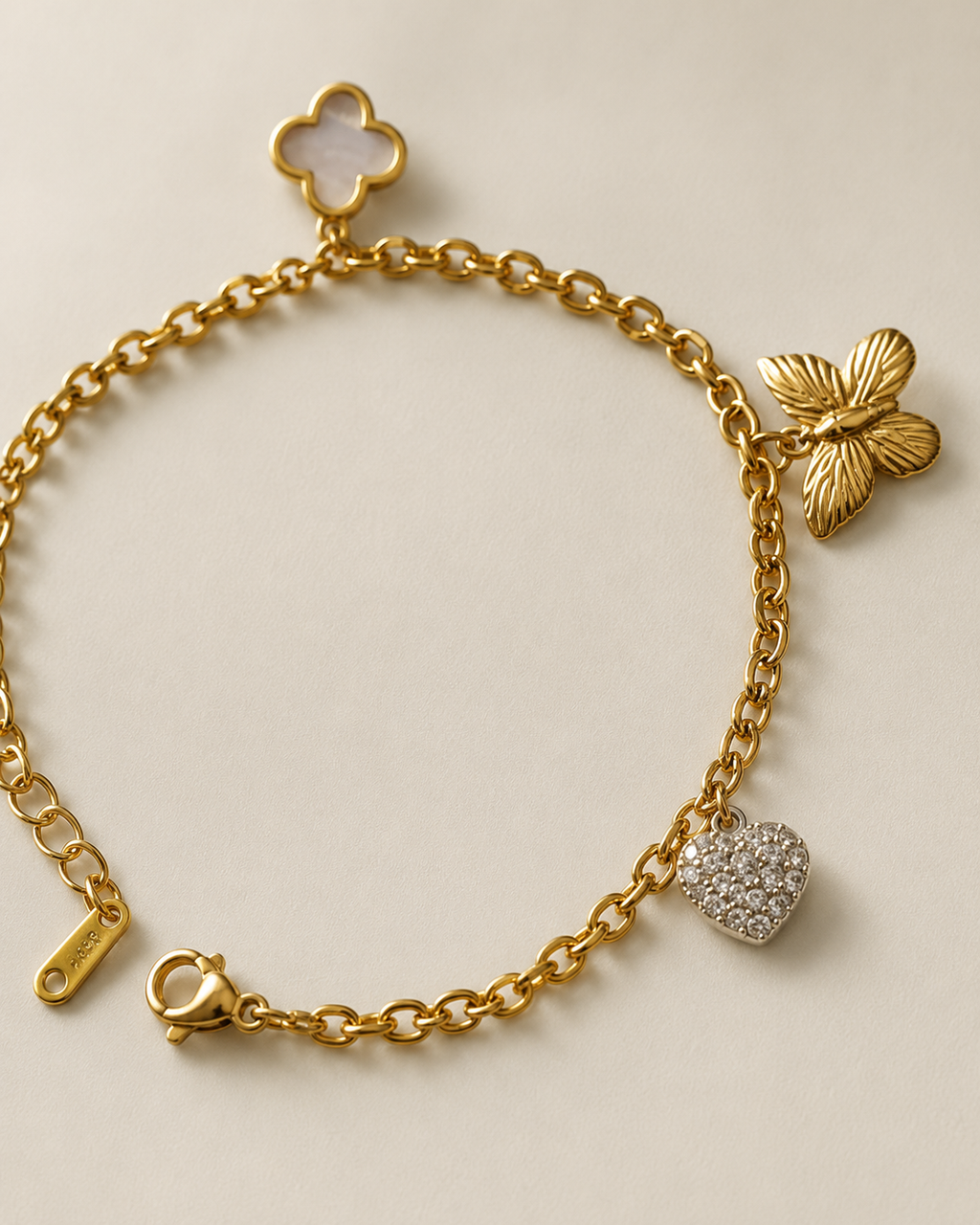 Clover, Butterfly & Crystal Heart Charm Gold-Plated Bracelet