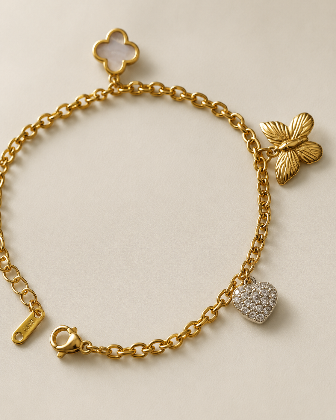 Clover, Butterfly & Crystal Heart Charm Gold-Plated Bracelet