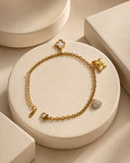 Clover, Butterfly & Crystal Heart Charm Gold-Plated Bracelet