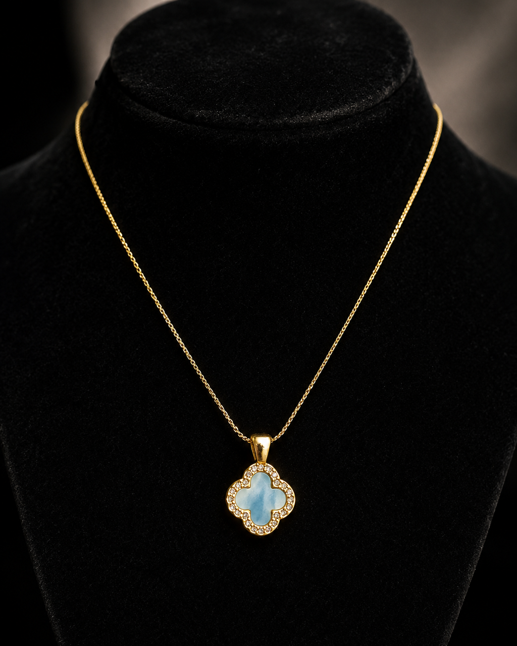 Gold-Tone Blue Quatrefoil Pendant Necklace with Crystal-Like Border