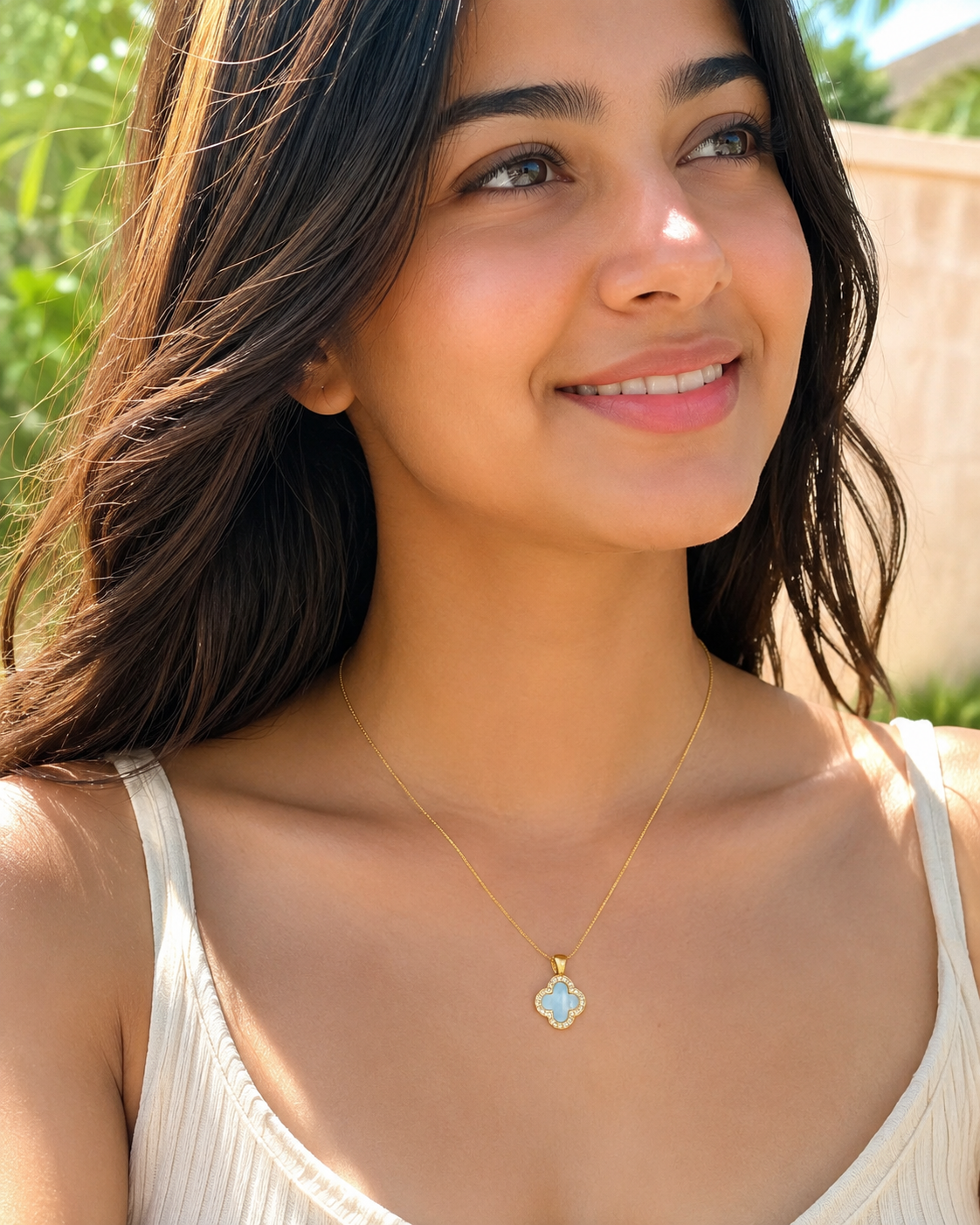 Gold-Tone Blue Quatrefoil Pendant Necklace with Crystal-Like Border
