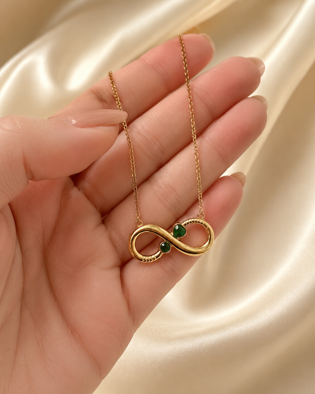 Gold-Plated Infinity Necklace with Green Crystal Accents
