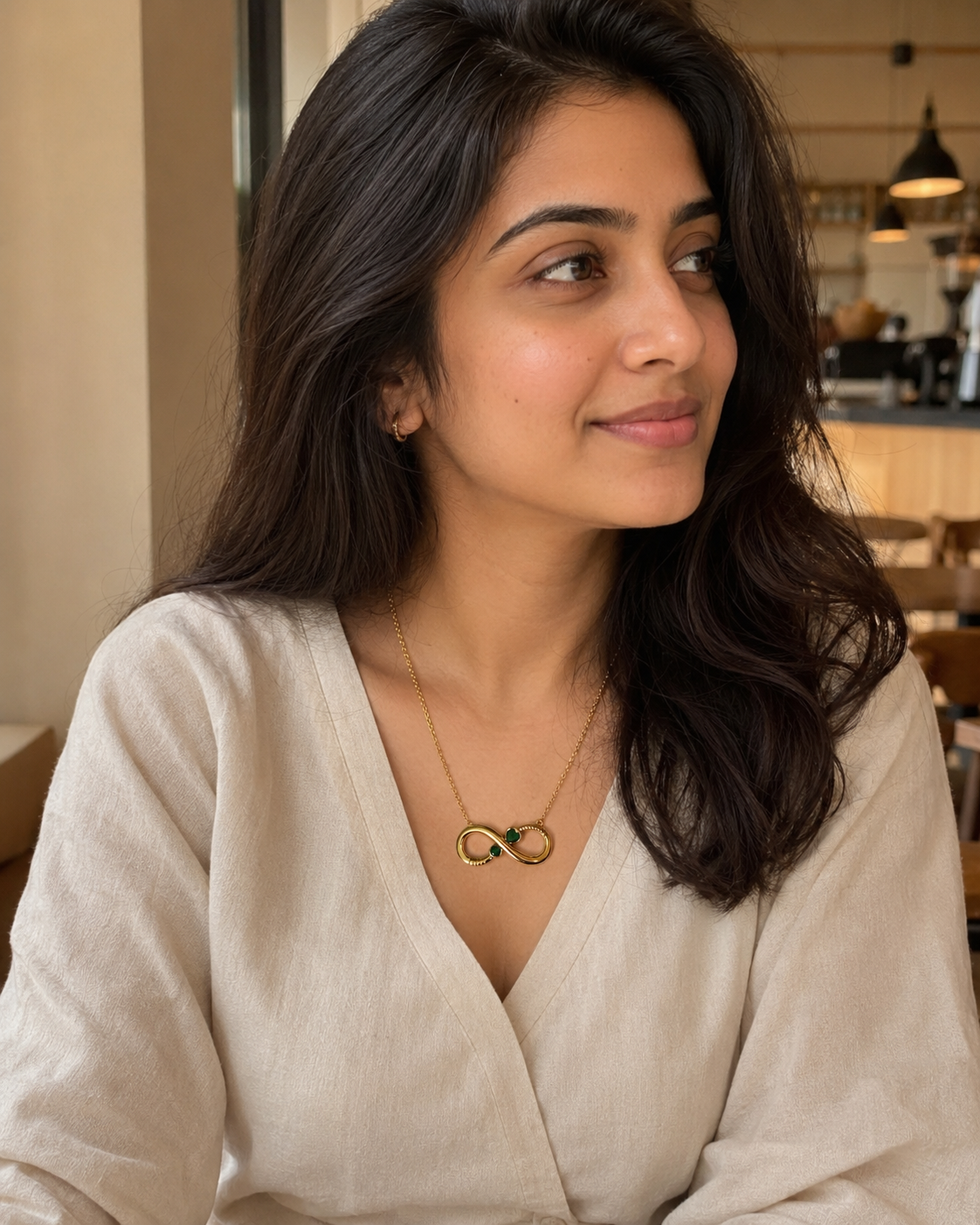 Gold-Plated Infinity Necklace with Green Crystal Accents