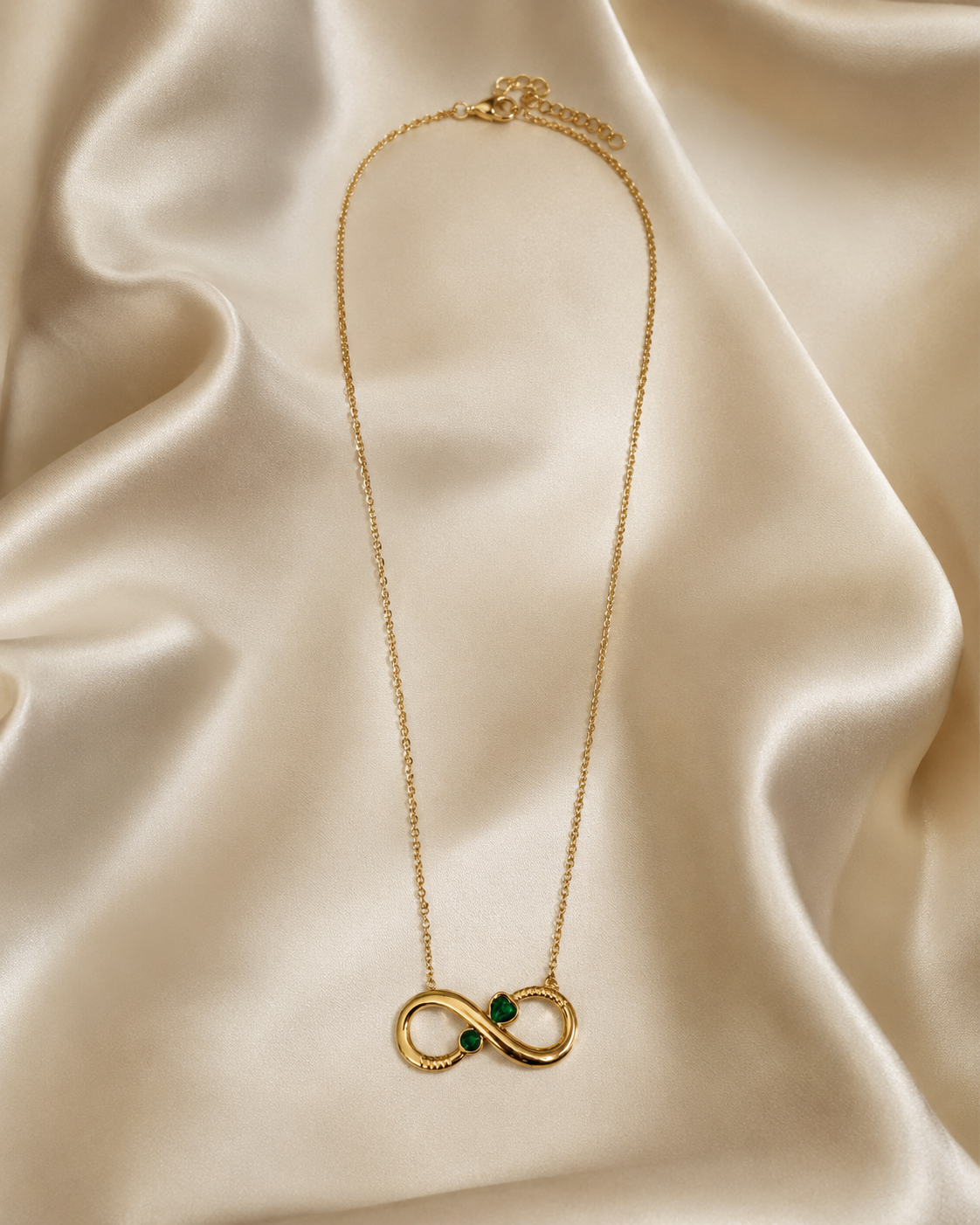 Gold-Plated Infinity Necklace with Green Crystal Accents