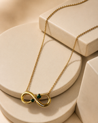 Gold-Plated Infinity Necklace with Green Crystal Accents