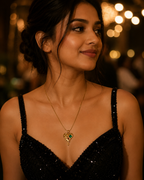 Gold-Plated Melting Heart Pendant Necklace with Green Crystal Accent